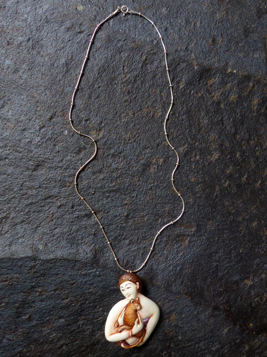 Hand-Carved-Hand-Painted-Bone-Woman-Holding-Cat-Necklace-by-Susan-Tereba